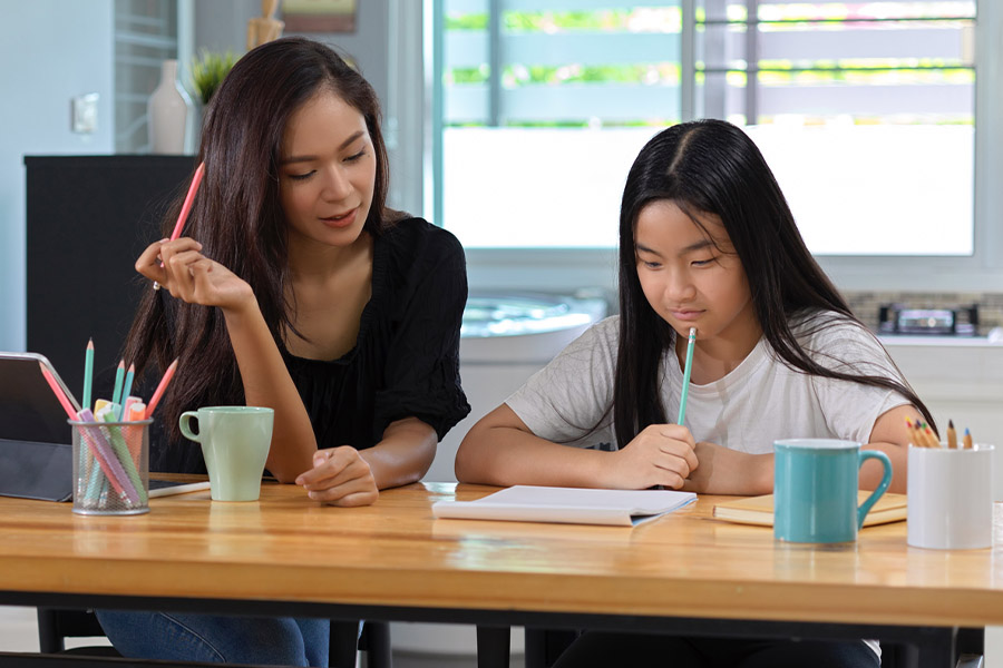 student and tutor together at a desk in Tacoma